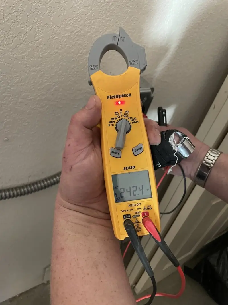 Voltage testing with clamp meter during Circuit Breaker Repair in Brigham City